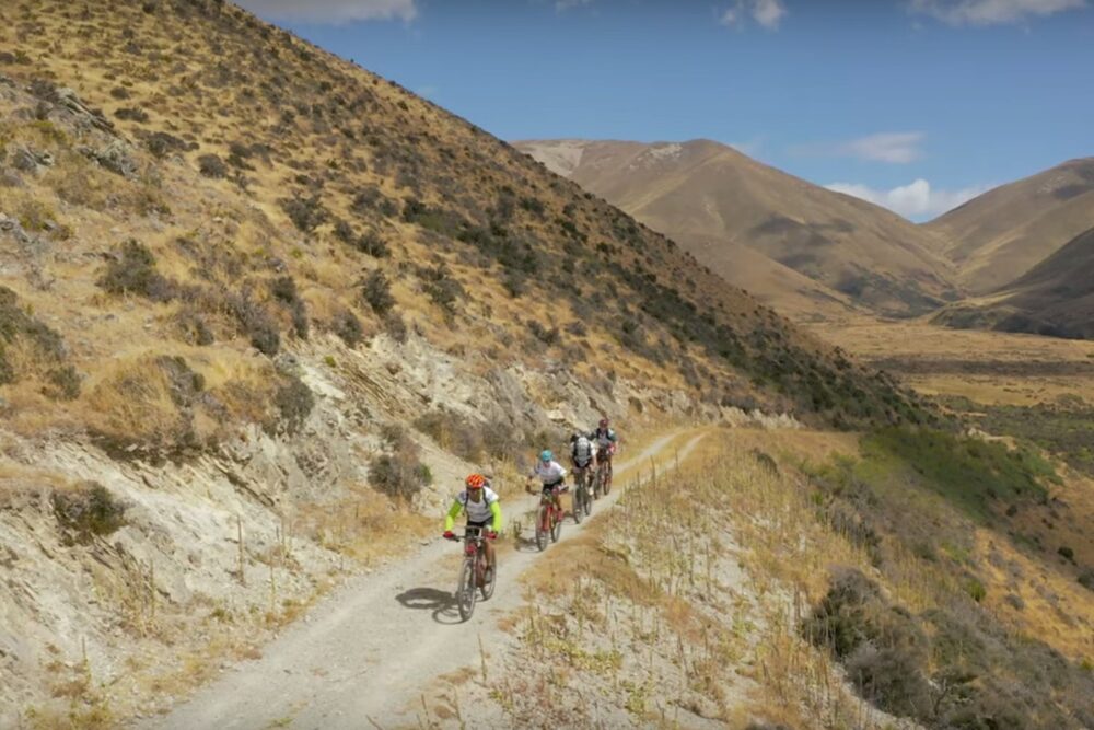 Adventure Racers Walking By A Mountain