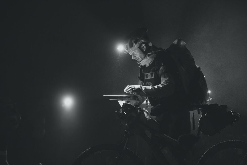 Man Reads a Map in the Dark